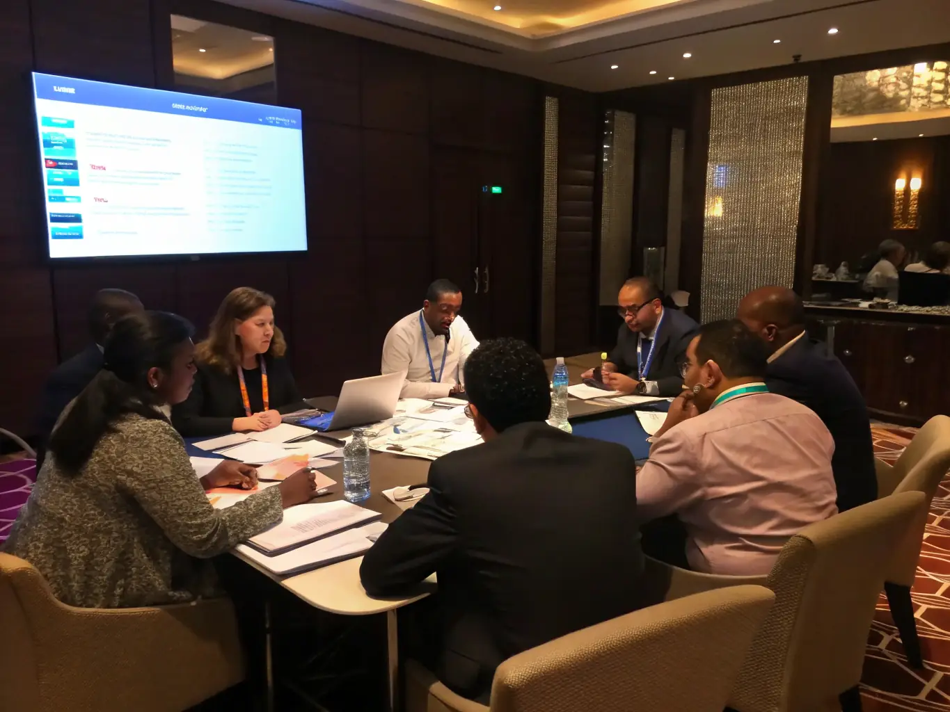 A diverse group of professionals in a collaborative meeting.